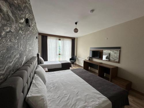 Кровать или кровати в номере Alya Teras Otel