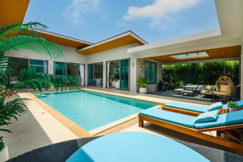 an image of a swimming pool in a villa at Villa Mimosa 1, Splendid 4 Bedroom Master Ensuite in Phuket Town