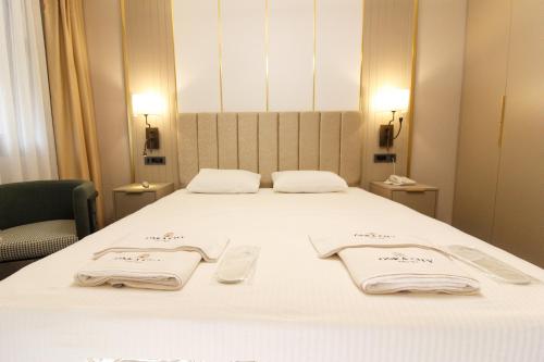 Кровать или кровати в номере ONKA OTELCİLİK TURİZM TİCARET LİMİTED ŞİRKETi