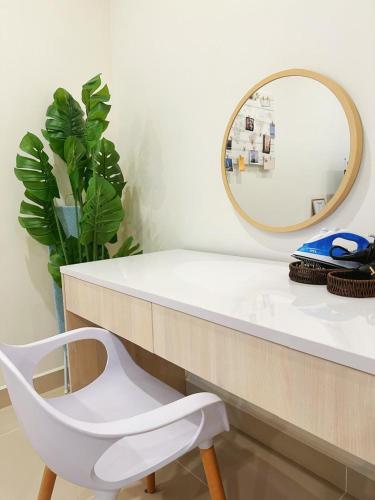 a bathroom with a white counter and a mirror at SummerDay Seaview Studio Apartment at Kota Kinabalu City Centre in Kota Kinabalu