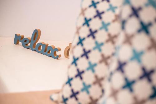a blue and white vase sitting next to a sign at Traditional Luxury House in Kalithies
