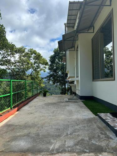 a balcony of a house with a view at Willow Nest in Anachal