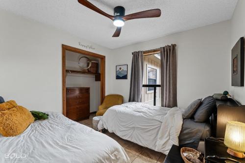 a bedroom with a bed and a ceiling fan at Cool Moss Stone Lodge Wkayaks & Canoes in Karnack