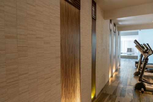 a gym with tread machines on the wall at Terrado Suites Iquique in Iquique