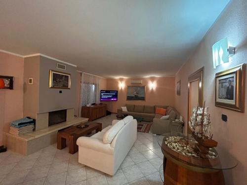 a living room with a couch and a table at Villa Desideria in Bribir