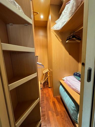 a small room with a bed and a closet at Casa Max in Capannori