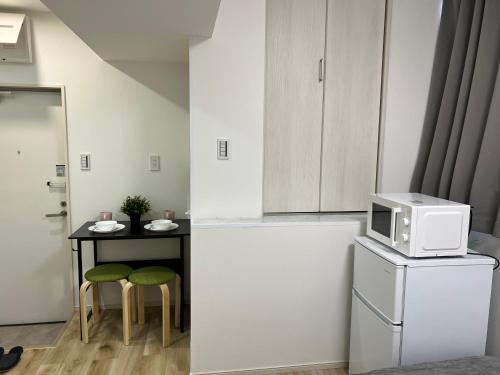 Η κουζίνα ή μικρή κουζίνα στο Ikebukuro Area R1 NishiikeApartment 5F No Elevator