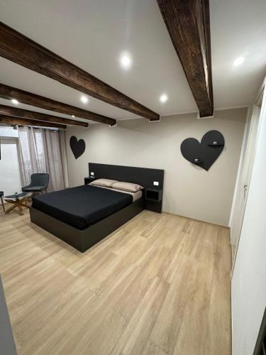 Кровать или кровати в номере Residenza De Rose 2