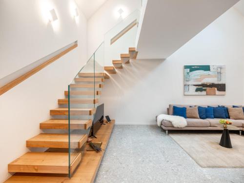 a staircase in a living room with a couch at Residence Soča in Soča