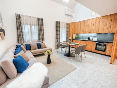 a living room with a couch and a table at Residence Soča in Soča
