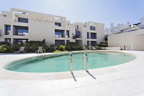 a swimming pool in front of a building at Casas do Forte by MY CHOICE in Tavira