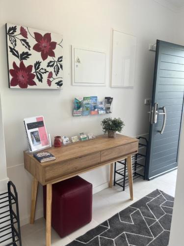 a wooden desk in a room with a door at Casa Senhora Da Estrela 1, 2 or 3 bedrooms in Ribeira Grande