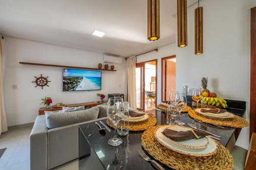 a living room with a table and a couch at Bahia Soul - Lake House - Barra Grande - Península de Maraú in Barra Grande