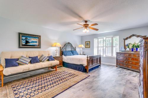 a bedroom with a bed and a ceiling fan at 4 Mi to Beach Family-Friendly Home in Navarre in Navarre