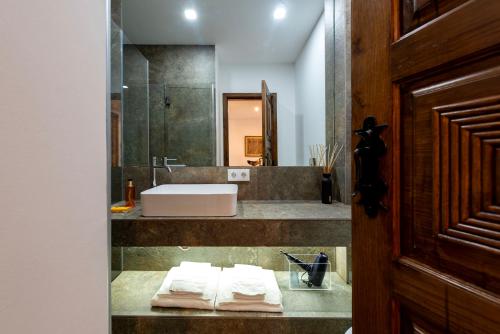 a bathroom with a sink and a counter with towels at Porto Premium River View II in Porto