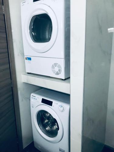 a washer and a washing machine in a bathroom at Dorian in Kos Town