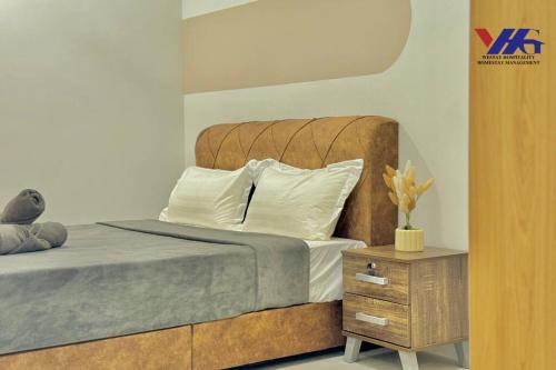Ένα ή περισσότερα κρεβάτια σε δωμάτιο στο Arena Designer Deluxe Suite KLIA