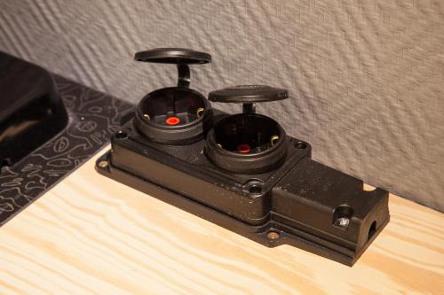 a black electronic device sitting on top of a table at Newport in Dnipro