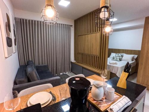 a living room with a couch and a table in a room at FLATS - DUO JK in Sao Jose do Rio Preto