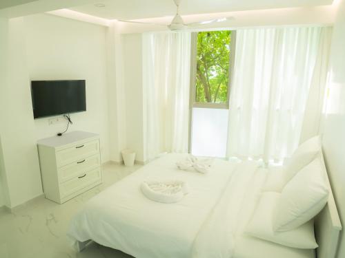 Postel nebo postele na pokoji v ubytování Beachfront Apartment