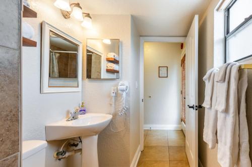 a bathroom with a sink and a shower at Waterview from Top Floor Condo in Dunedin
