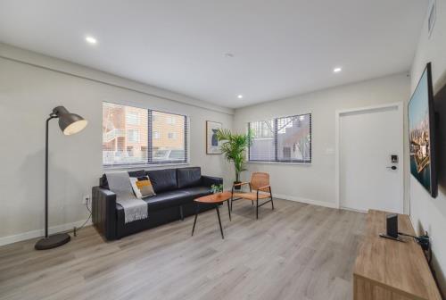 a living room with a couch and a table at Prime Location Apt on Calle Ocho in Little Havana in Miami