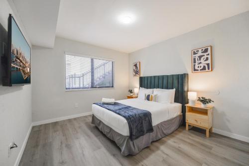 a bedroom with a large bed and a window at Prime Location Apt on Calle Ocho in Little Havana in Miami