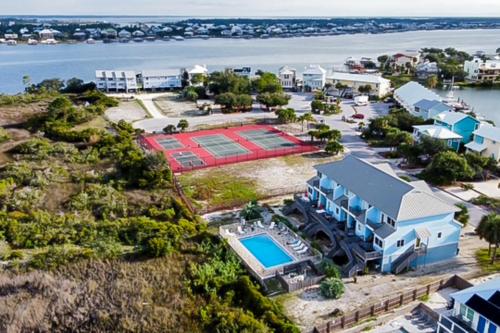 an aerial view of a resort with a tennis court at Sharp Reef on the Gulf #5 in Pensacola