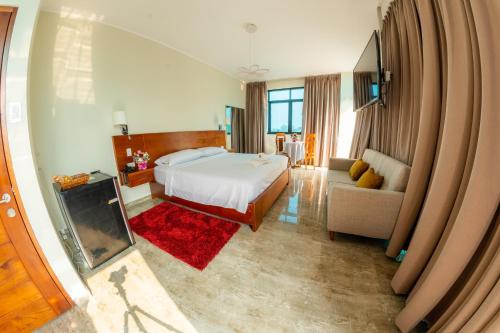 Un ou plusieurs lits dans un hébergement de l'établissement Caruzo Hotel and suites