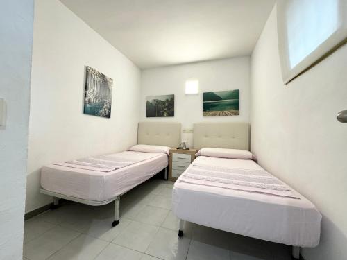Postel nebo postele na pokoji v ubytování Apartsalou Argenta