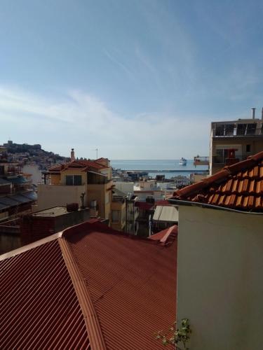 a view of a city from the roofs of buildings at Giannis and Aristi's House in Kavala