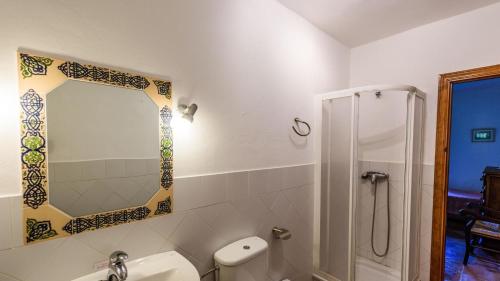 a bathroom with a toilet and a sink and a shower at Casa del Tigre Gaucín by Ruralidays in Gaucín