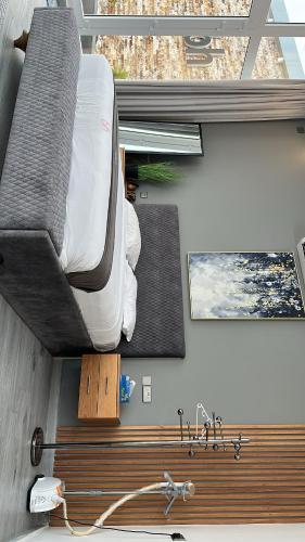 a bedroom with a bed and a sink in a room at bh villa in Al Ashkharah