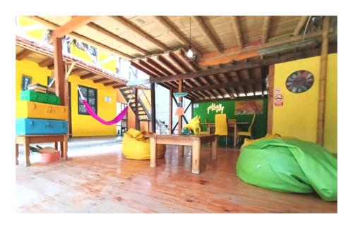 a living room with a table and a tent at Casa Naranja in Máncora