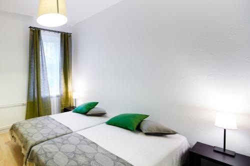Lote Apartment tesisinde bir odada yatak veya yataklar