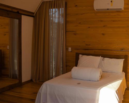 Postel nebo postele na pokoji v ubytování Pousada Morada das Araucarias
