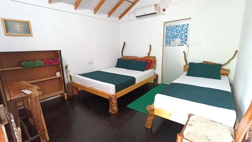 Cama o camas de una habitación en Nature Beach Huts