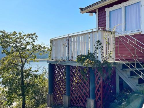 a house with a balcony on the side of it at 8 person holiday home in Uddevalla-By Traum in Uddevalla
