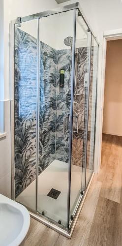 a shower with a glass enclosure in a bathroom at Adriroomsrho in Rho