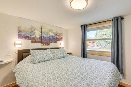 a bedroom with a bed and a large window at 4 Mi to Ski Resort Pet-Friendly Breck Cabin in Breckenridge