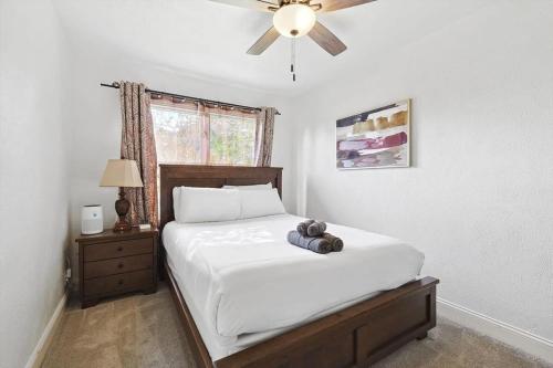 a bedroom with a bed with a teddy bear on it at 4-BD 2-BA Home Retreat Laundry Backyard in Weatherford