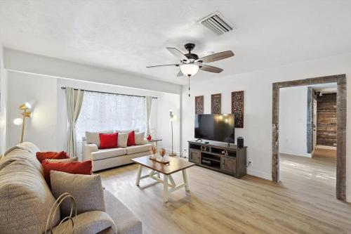 a living room with a couch and a ceiling fan at 4-BD 2-BA Home Retreat Laundry Backyard in Weatherford