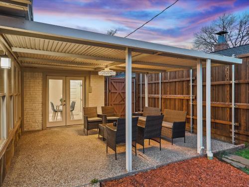 a pavilion with chairs and a table on a patio at Ridgefield Estate 5BED Backyard Games in Plano