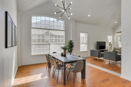 a dining room with a table and chairs at Luxury Mansion Paradise - Cinema Room, Pool, Spa in Rowlett