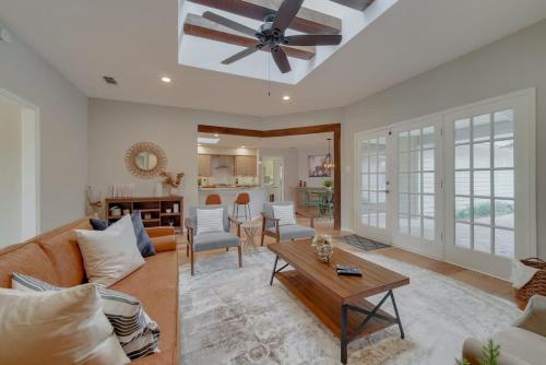 a living room with a couch and a table at Best of Richardson - 5BD-3BA with Pool, Patio, BBQ in Richardson