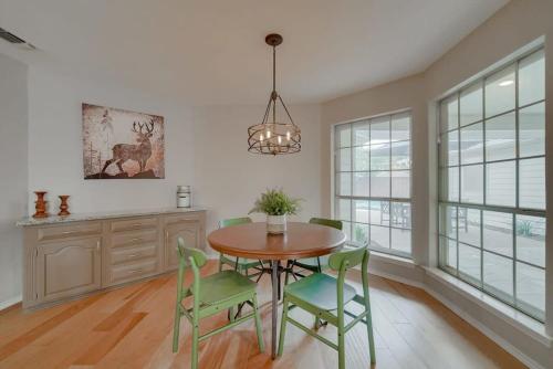 a dining room with a table and green chairs at Best of Richardson - 5BD-3BA with Pool, Patio, BBQ in Richardson
