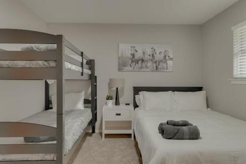 a bedroom with two bunk beds and a ladder at Best of Richardson - 5BD-3BA with Pool, Patio, BBQ in Richardson