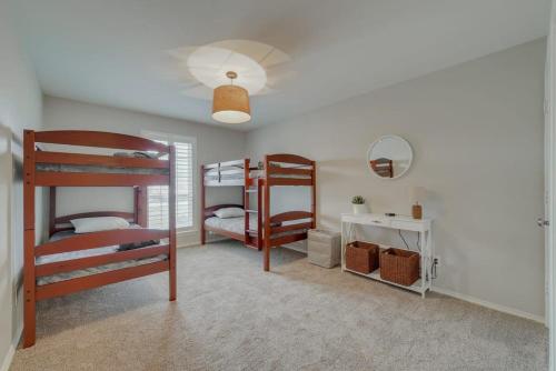 a bedroom with two bunk beds and a mirror at Best of Richardson - 5BD-3BA with Pool, Patio, BBQ in Richardson