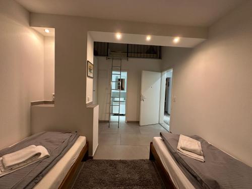 Ένα ή περισσότερα κρεβάτια σε δωμάτιο στο Estelada Boarding Houses - Bogenhausen