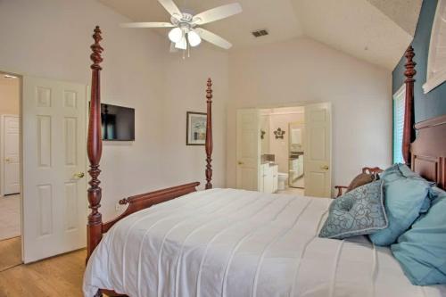 a bedroom with a bed and a ceiling fan at Heart of Rowlett - 3 BD 2BA Cozy Getaway w Patio in Rowlett